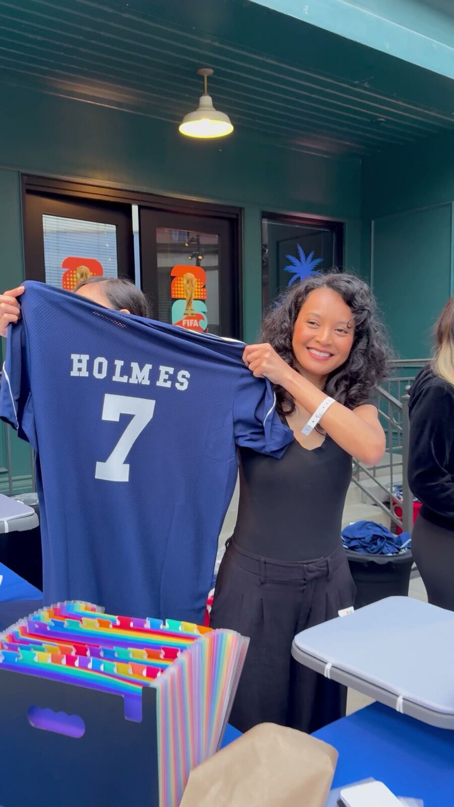 Guests gathered around a live merch station at a private party