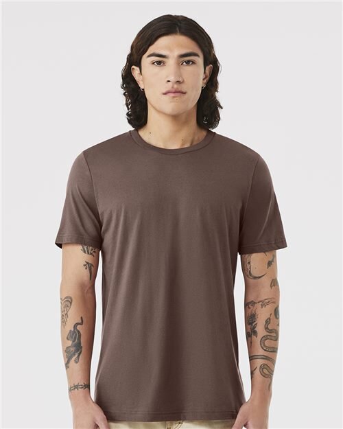 Model wearing a blank Bella+Canvas 3001 tee in soft mauve-brown
